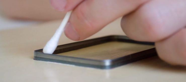 Die-Slide being applied using a cotton swab